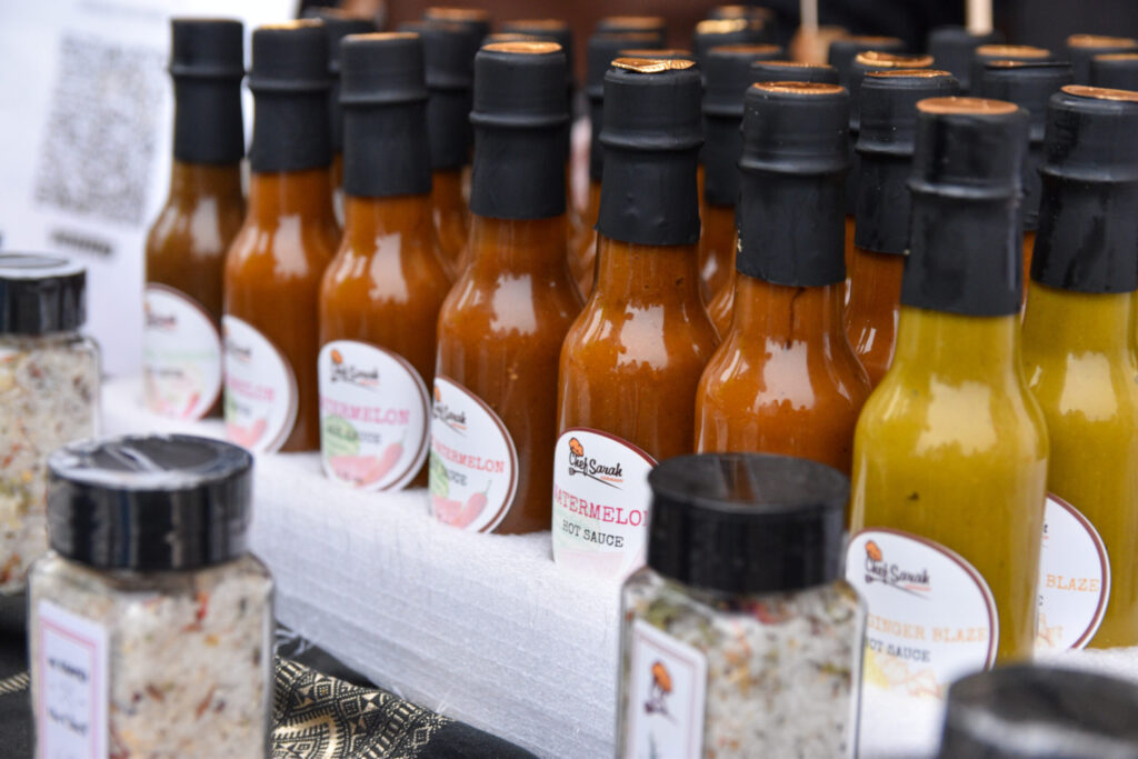 A row of hot sauce bottles