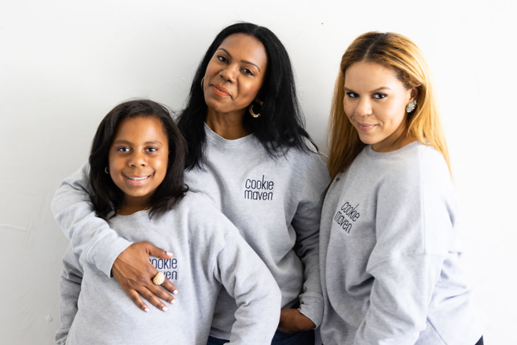 A photo of three people wearing Cookie Maven crewneck sweaters